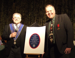 Geoff and Mike unveil the Centenary Plaque